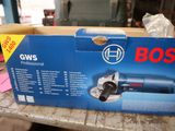 boxed box of bosch power tools on a table in a workshop
