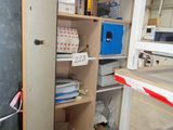 a large open cabinet with a lot of items on it