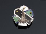a picture of a pin with a clock tower on it