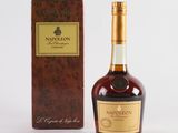 a close up of a bottle of liquor next to a box