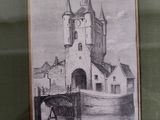 a drawing of a castle on display in a glass case