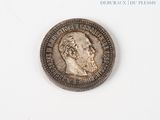 an old coin with a picture of a man on it