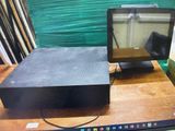 a laptop computer sitting on top of a wooden table