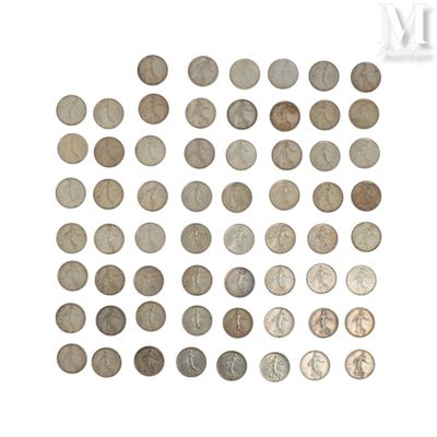 a bunch of coins sitting on top of each other on a white surface