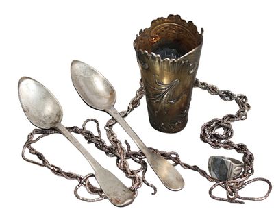 several spoons and spoon spoons are sitting next to a cup
