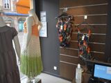 mannequins and dresses on display in a clothing store