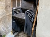 a chair that is sitting in the corner of a building