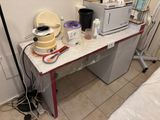 a table with a microwave and a blender on it