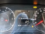 a close up of a car dashboard with a speedometer and gauges
