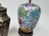 two vases sitting next to each other on a table