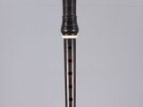 a close up of a flute on a table with a gray background