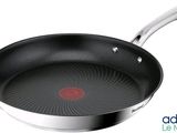 an image of a frying pan with a red dot on it