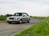 a car that is driving down the road on the side of the road