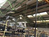 a picture of a large warehouse with a lot of equipment