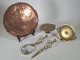 several different types of brass objects including a bowl, spoon, and a magnifying glass