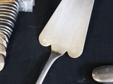 a knife, fork, and spoon sitting on a table