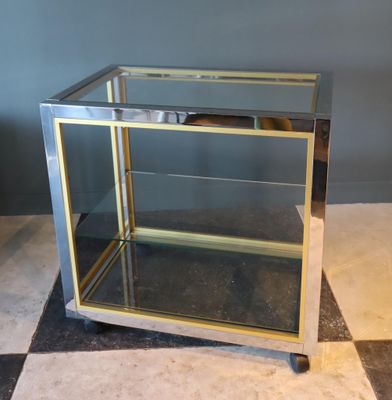 Renato ZEVI Étagère à roulettes En métal chromé et laiton De…