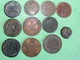 a lot of coins that are sitting on a green surface