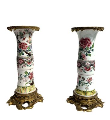 two vases that have been decorated with flowers and birds on them