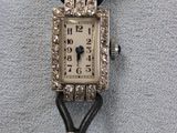 an image of a woman ' s wrist watch with diamonds on it