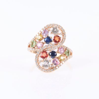 an image of a ring with multi colored stones on a white background