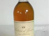 an image of a bottle of wine sitting on top of a table