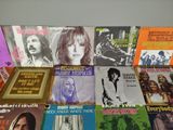 a lot of music cds on the table together