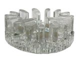 a clear glass candle holder with a candle inside of it