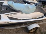 a white and black jet ski parked on a trailer
