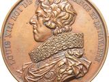 une image montrant un gros plan d'une médaille sur fond blanc