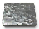 a picture of a laptop that is made out of mother of pearl