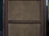 a wooden cabinet that is sitting in a room