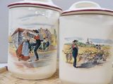 two cups with pictures of people on them on a tray