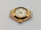 an image of a gold watch on a white surface