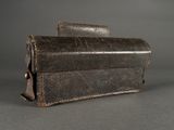 leather case for a camera on a gray background