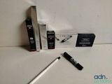 a pen and a box of mascaras on a table