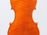 an old violin with a wooden back and a long neck