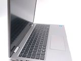a silver laptop computer sitting on top of a white table