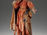 statue of a man in a red robe holding a sword