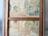 an old picture frame with a painting of a landscape on it