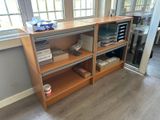 a wooden shelf with many items on it in a room