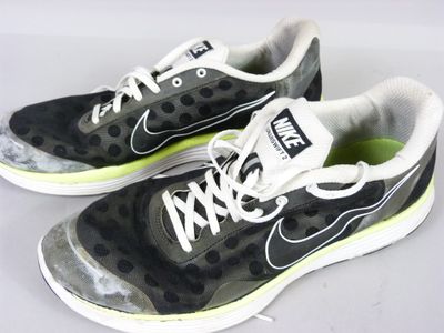 pair of black and white sneakers with polka dots on them