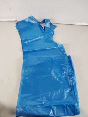 a blue plastic bag on the floor next to a wall