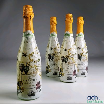 four bottles of champagne with a map on them sitting next to each other