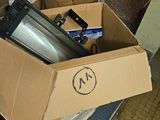 a cardboard box with a bunch of items inside of it