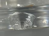 a close up of a glass container with water inside of it