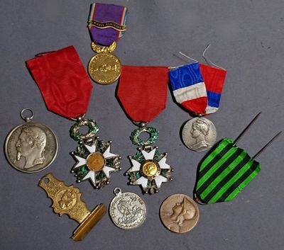 many medals and medals that are on a table