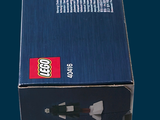 a box of legos sitting on a blue surface