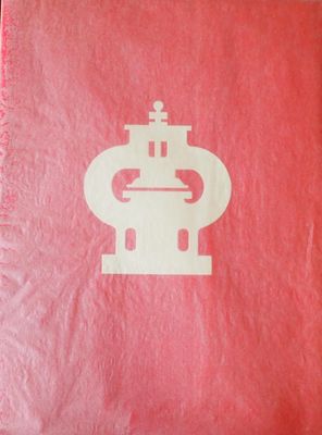 une image représentant un livre rouge sur lequel figure l'illustration d'un robot
