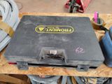 a tool box sitting on top of a wooden table